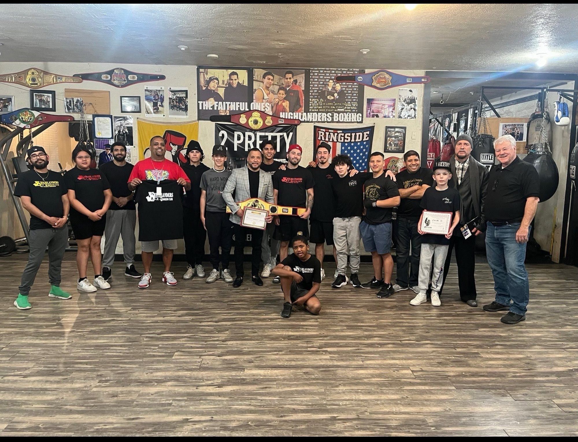 HBC team and youth gathered in the gym for a financial literacy program session