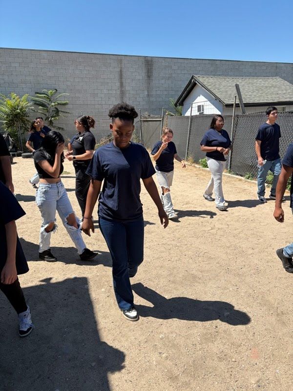 HBC summer camp participants moving through outdoor fitness and conditioning drills